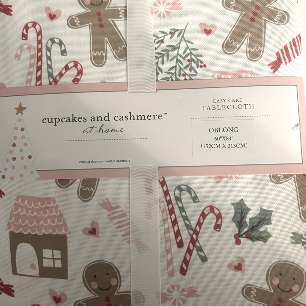 Cashmere and cupcake adorable oblong tablecloth new with tags.  Size 60x84